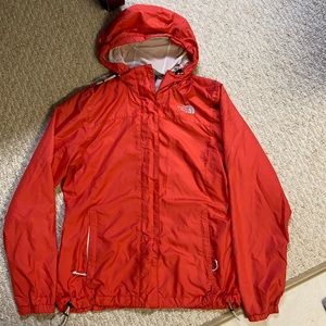 women’s North face size Medium orange wind breaker